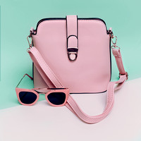 Stylish ladies accessories. Sunglasses & Handbag. Focus on paste