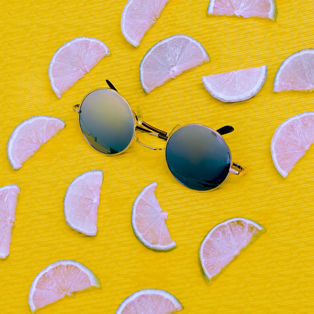 Fashion Mix. Stylish Sunglasses and Lemons. Be in trend